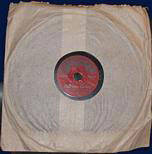 An early 1920s miniature gramophone record on the Mimosa label produced for F.W. Woolworth in the UK by the Crystalate Gramophone Record Company of Tonbridge, Kent. The lack of a stamp on the label means that this is the royalty-paid "B-side"