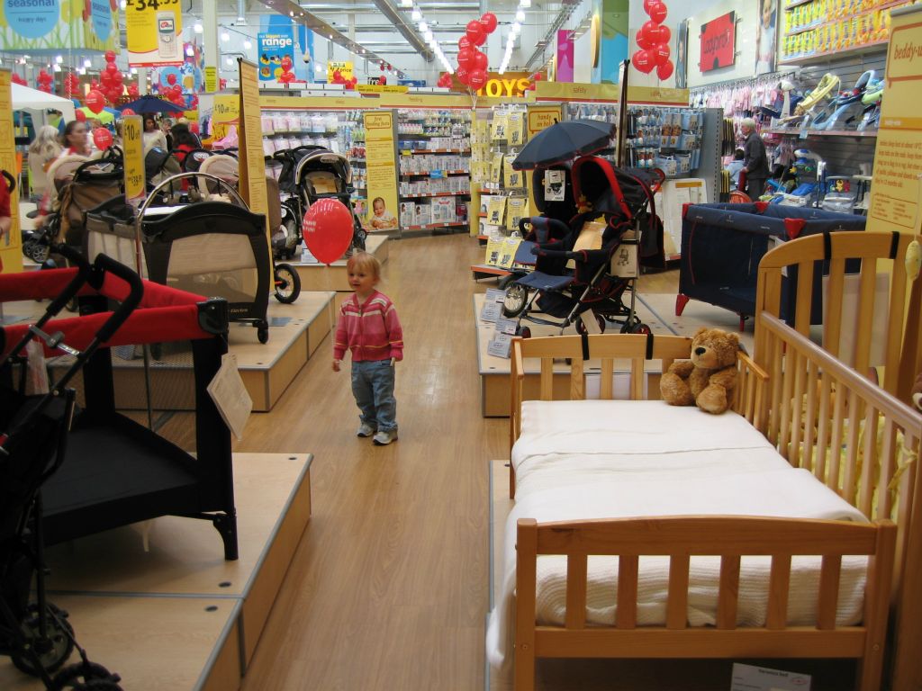 A toddler examines the huge baby shop at Woolworths out-of-town Bristol Hartcliffe (2005)