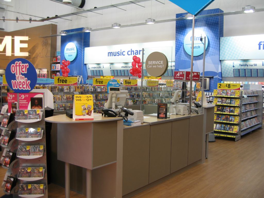 A second view of the huge entertainment department in an out-of-town Woolworths store in 2005, shows its service desk and music chart