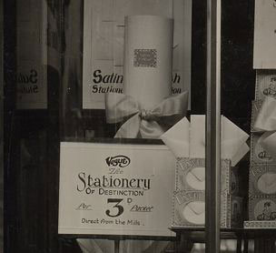 A window display promoting Woolworths' latest line in stationery - luxurious paper straight from the mill at threepence (1½p) per pad