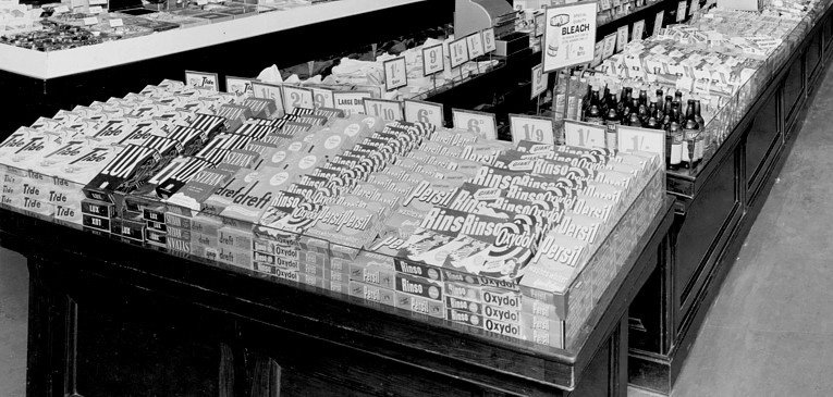 1950s cleaning products, including several brands that remain popular in the supermarkets today, on sale in Woolworth's in 1950 on a single level personal service island counter