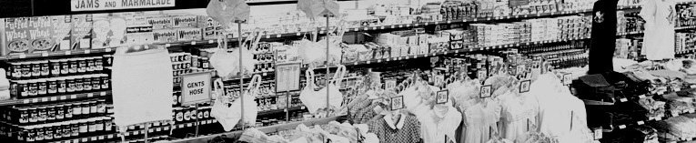 A wall display of groceries, hidden behind the clothing island, as Woolworth started to experiment with the possibility of a supermarket operation in the Portsmouth store in 1950