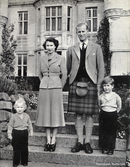 A Royal Family portrait taken at Balmoral in 1952 with Her Majesty the Queen, HRH The Duke of Edinburgh, Prince Charles and Princess Anne standing on the steps. Image courtesy of Studio Lisa, reproduced from the F. W. Woolworth New Bond magazine of June 1953