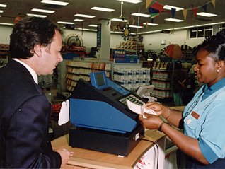 Woolworths PR Executive Mike McGann buys an inaugural ticket in Camelot's National Lottery - introduced in 1994. Woolworths was the only national retailer to have the system fully live for the launch