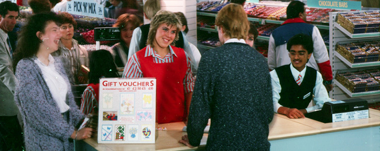 New look orange uniforms for Woolworths staff in the larger stores were progressively introduced from 1985 New look orange uniforms for Woolworths staff in the larger stores were progressively introduced from 1985
