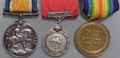The World War I service medals awarded to four Picot brothers - John, Clement, Frank and George (left and right) and the F.W. Woolworth long-service medal awarded to Frank and Phil (centre)