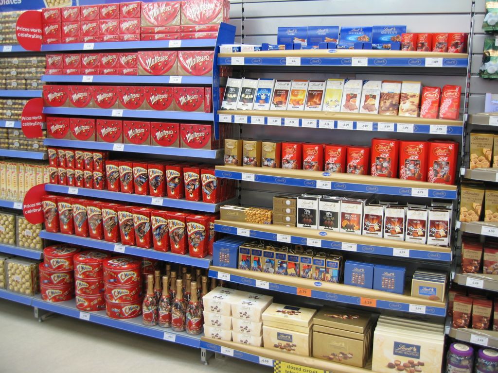 Luxury chocolate brands alongside popular lines like Celebrations and Maltesers in this out-of-town Woolworths store display (2005)