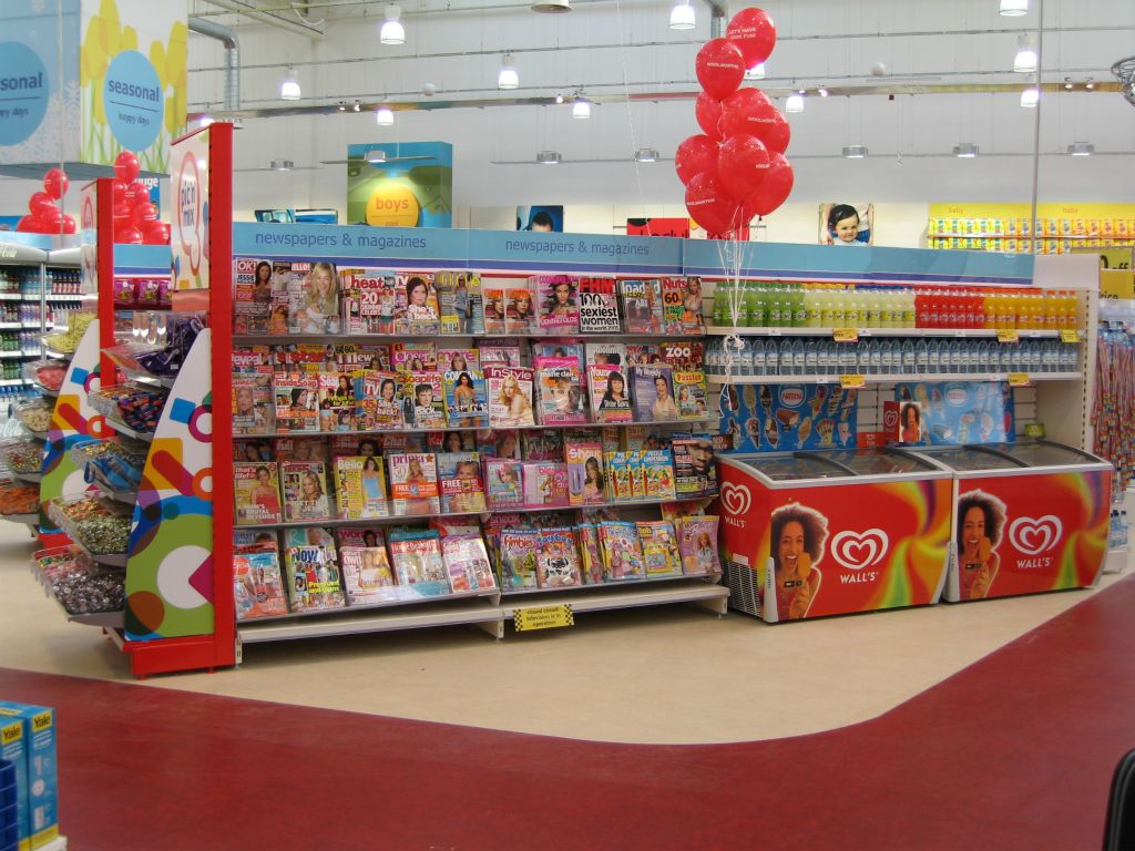 Glossy magazines and ice cream were displayed on the outer-edge of the sweet department near the checkouts to stimulate impluse purchase