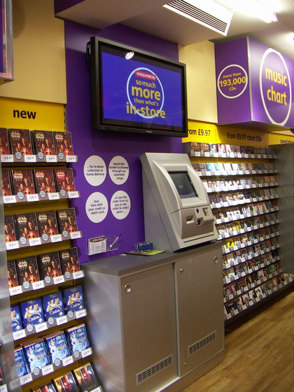 An IBM/Retec touch screen ordering kiosk, perched in the middle of the Entertainment displays in Woolworths, Kingswood, Bristol in 2005