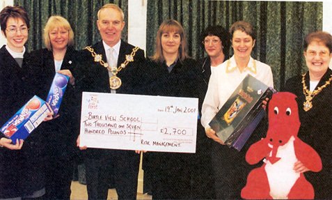 Members of the Castleton Risk Management Team handing over a cheque for £2700 for Belle View School to the Mayor and Mayoress of Rochdale