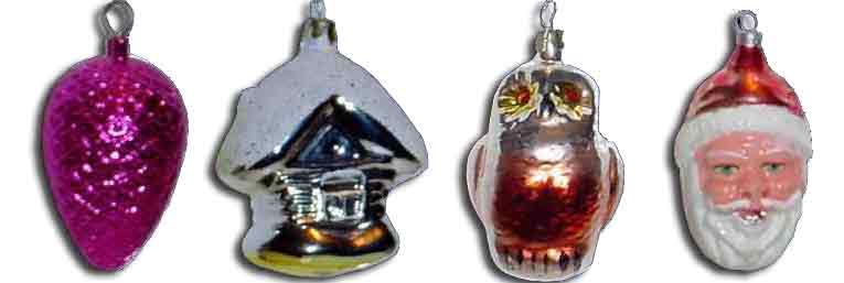 Woolworth Glass Christmas Decorations from the late nineteenth century. Each was blown by a German craftsman.  Left to right: acorn, cootage, owl and Santa (Saint Nick).