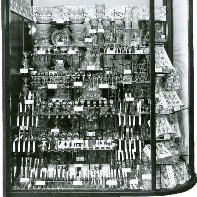 A 1951 Woolworth window display in 1951, featuring a complete range of glassware and cutlery