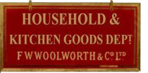 A maroon and gold sign promoting F. W. Woolworth's Household and Kitchen Goods Department - a pre-war favourite