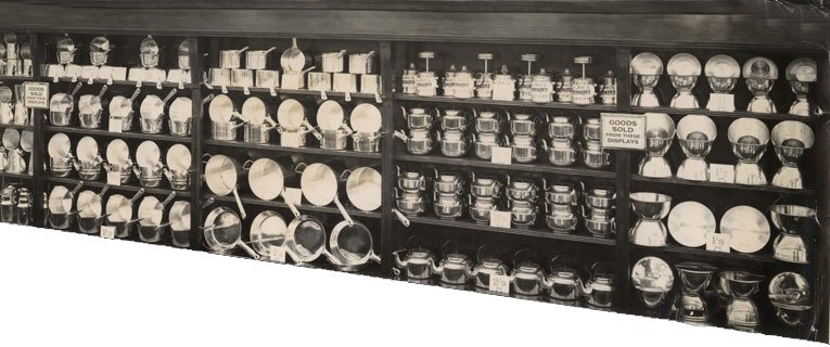An early 1950s wall display of saucepans in an F. W. Woolworth store