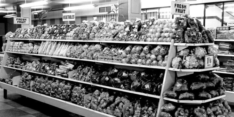 Fruit and vegetables on a self service gondola island in Woolworths, Briggate, Leeds in 1959