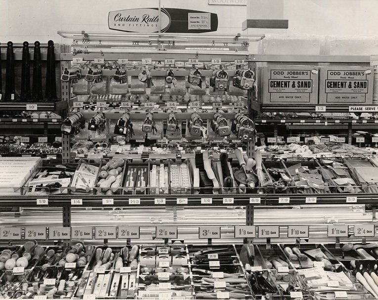 By 1953 new fixtures were used to add shelves above some of the personal service counters. The extensions allowed the range to be broadened to incoporate larger products like economy bags of sand and cement, and display headers for the exclusive Ezeglide Curtain Tracks, crafted for the company by Harrison Drape'.