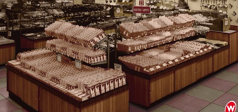 A full island of electric lamps was displayed in the larger Woolworth stores by the mid 50s.  Tiered shelving was used to get plenty of bulbs on sale.