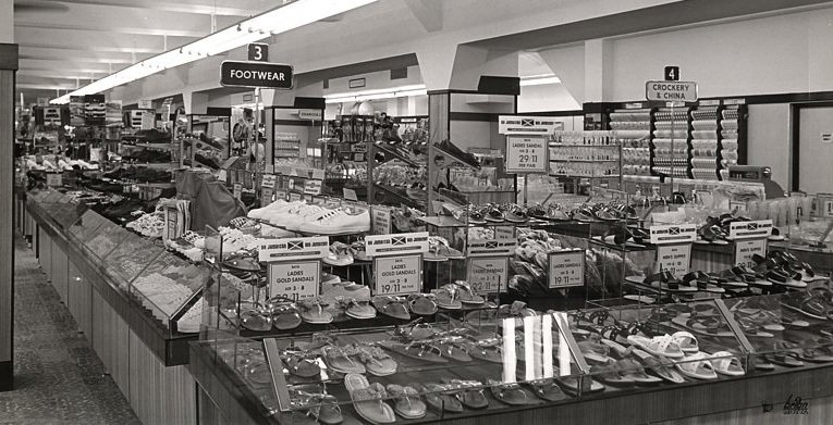 The salesfloor of the F. W. Woolworth store in Montego Bay, Jamaica pictured in around 1964. By this stage (despite signs in the foreground promoting Jamaican manufactured goods) overall the range has become more anglicised.