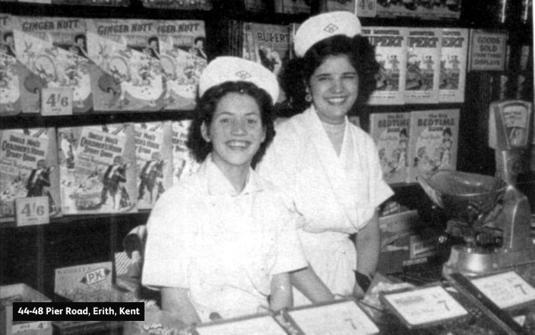 Two Woolworth workers show off the range of Pic'n'Mix Candy at the Pier Road, Erith, Kent store in the UK