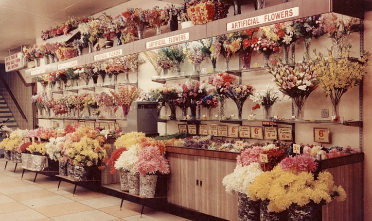 The range of artificial flowers - made from plastic, paper and silk, was a popular addition to the Woolworth range in the 1950s, as shown by this rare full colour photgraph