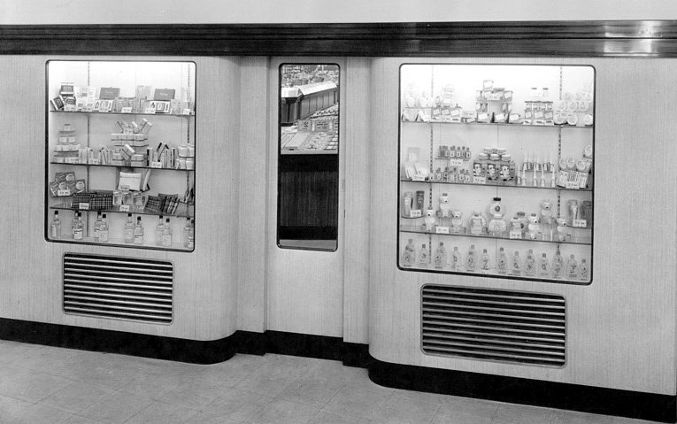 New city centre Woolworth stores included glass showcases on the reverse of the enclosed windows at the front. These were used to display perfumes, jewellery and watches.