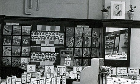 Bold displays of picture books and wrapping paper in the new Woolworth store in Warwick, which opened in 1952. (Note the patriotic picture of H.M. The Queen above the wall display)