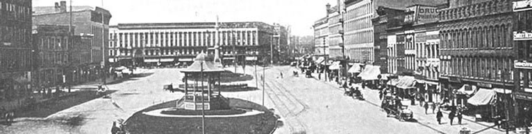 Watertown, New York at the end of the nineteenth century. The Augsbury and Moore Dry Goods Store at American Corner is in the centre of the picture in the distance.