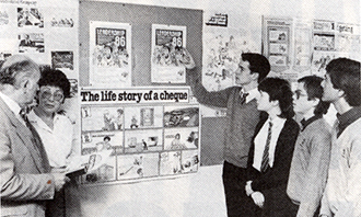 John Urry, the Manager of Woolworth Branch 475 in Aberystwyth, briefs Anita Jones and some of her pupils on Leadership '86, the Company's competition to find leaders of the future