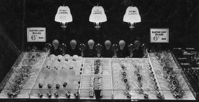 The lightbulb counter at F.W. Woolworth in Chorley Lancashire in 1935. Its 60 and 100 watt incandescent bulbs were labelled 'low consumption' and were sold for sixpence. To maximise sales, the selection of bakelite fittings was placed right next to the bulbs.