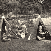 Stanley Swash MC, a rising star at Woolworth's Metropolitan District Office in the 1930s, in an unguarded moment playing with his children in his garden in 1935